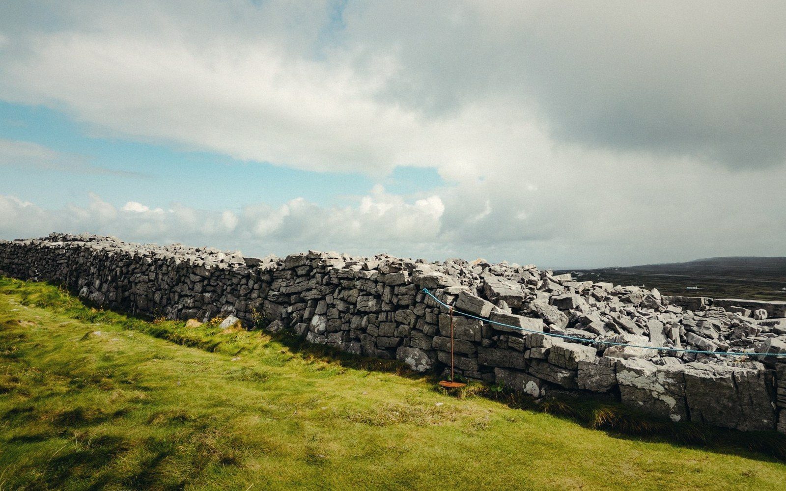 A drystone sheepfold enclosure on a mountainside